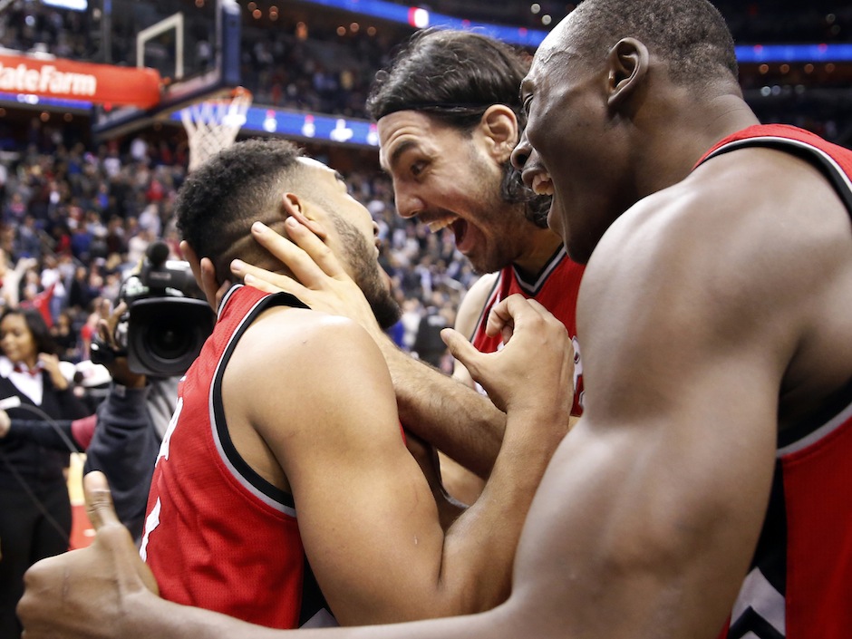 Toronto Raptors guard Cory Joseph left celebrates with forward Luis Scola center from Argentina and center Bismack Biyombo after an NBA basketball game Saturday Nov. 28 2015 in Washington. The Raptors won 84-82