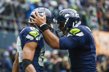 Dec 20 2015 Seattle WA USA Seattle Seahawks quarterback Russell Wilson celebrates with wide receiver Doug Baldwin after their touchdown pass and catch respectively against the Cleveland Browns during the first quarter at Century Link Field