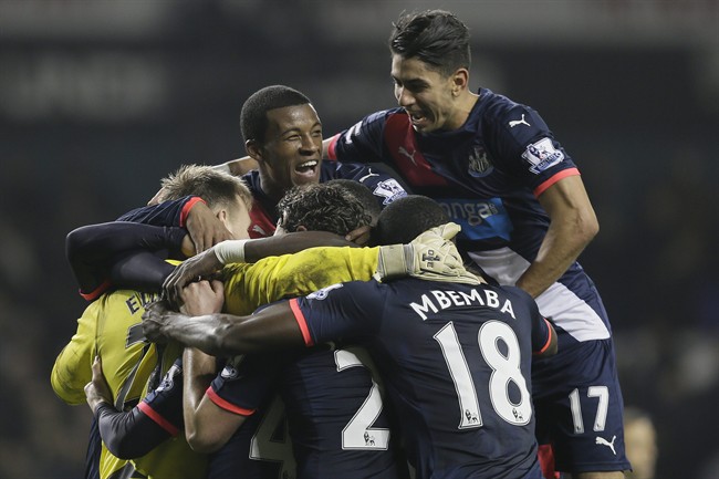 Newcastle players celebrate including winning goalscorer Ayoze Perez right during the English Premier League soccer match between Tottenham Hotspur and Newcastle United at White Hart Lane in London Sunday Dec. 13 2015