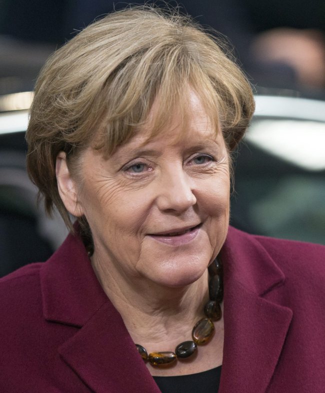 German Chancellor Angela Merkel casts her vote at the German Federal Parliament in Berlin