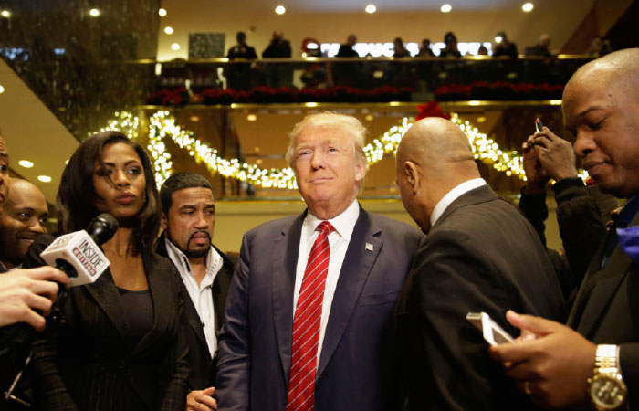 Republican Presidential candidate Donald Trump center joins a group of African American religious leaders to speak to reporters in New York on Monday. — AP