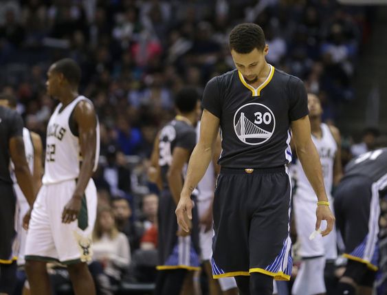 Stephen Curry looks down during the second half of an NBA basketball game against the Milwaukee Bucks Saturday Dec. 12 2015 in Milwaukee. The Bucks won 108-95