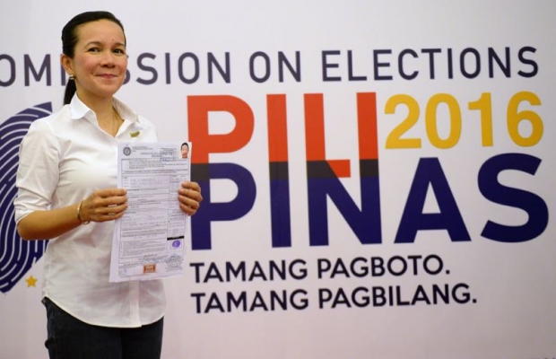 Philippine Senator Grace Poe daughter of the late popular movie actor Fernando Poe Jr shows her Certificate of Candidacy for president after filing at the Commission on Elections in Manila