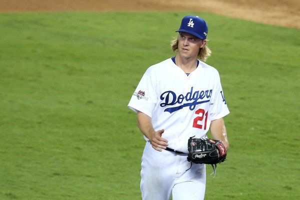 Zack Greinke #21 of the Los Angeles Dodgers walks to the dugout after being pulled in the seventh inning against the New York Mets in game five of the National League Division Series at Dodger Stadium