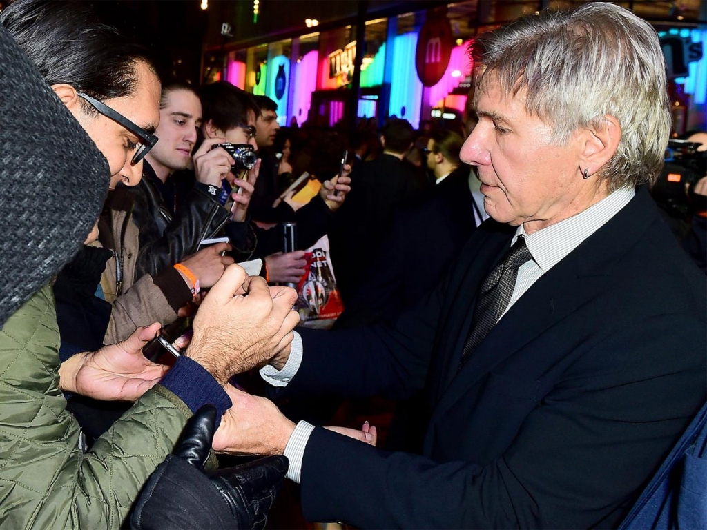 Harrison Ford signs autographs for fans on the red carpet PA