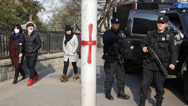 Heavily armed police officers near Sanlitun in Beijing after the US and British embassies warned of possible threats against westerners