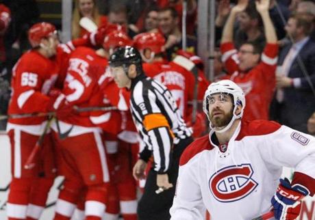 Canadiens defenseman Greg Pateryn skates away as the Red Wings celebrate the winning goal in the third period Thursday night