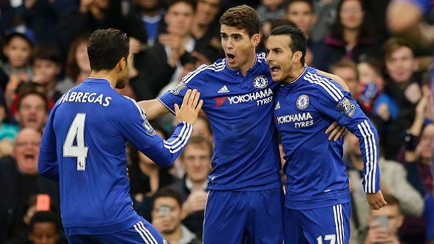 Chelsea's Pedro right celebrates scoring his side's second goal with Cesc Fabregas left and Oscar during the English Premier League soccer match between Chelsea and Sunderland at Stamford Bridge stadium in London on Saturday