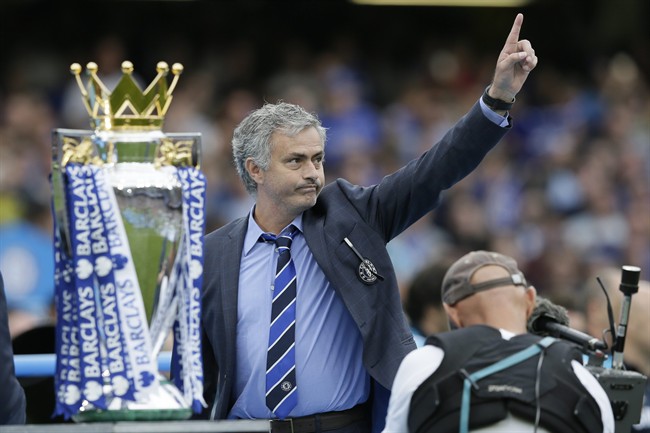 Mourinho waves to the crowd after the English Premier League soccer match between Chelsea and Sunderland at Stamford Bridge stadium in London. Chelsea were awarded the trophy after winning the En