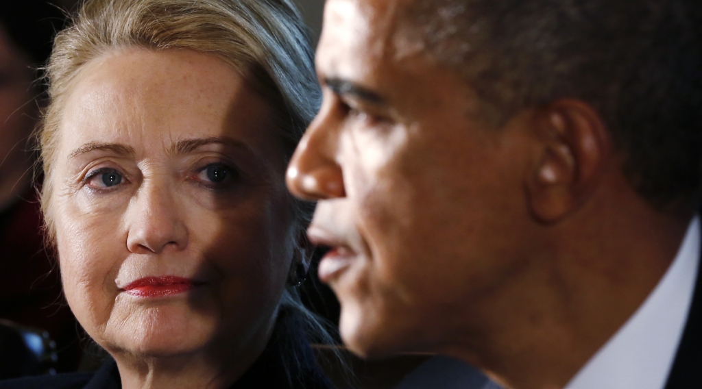 U.S. Secretary of State Hillary Clinton listens to U.S. President Barack Obama speak during a meeting with members of his cabinet at the White House in Washingt