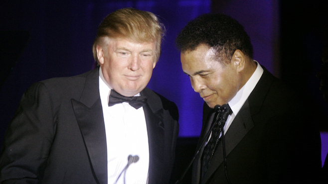 Donald Trump left accepts his Muhammad Ali award from Ali at Muhammad Ali's Celebrity Fight Night XIII in Phoenix Ariz. Ali is criticizing Republican presidential front-runner Trump’s proposal to ban Mu