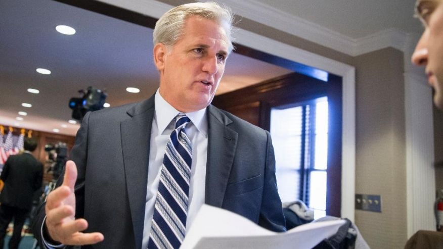 Majority Leader Kevin McCarthy R-Calif. speaks with a reporter following a closed-door GOP caucus meeting at the Republican National Headquarters on Capitol Hill in Washington Tuesday Dec. 8 2015. Invoking the Paris terror attacks House lawmakers