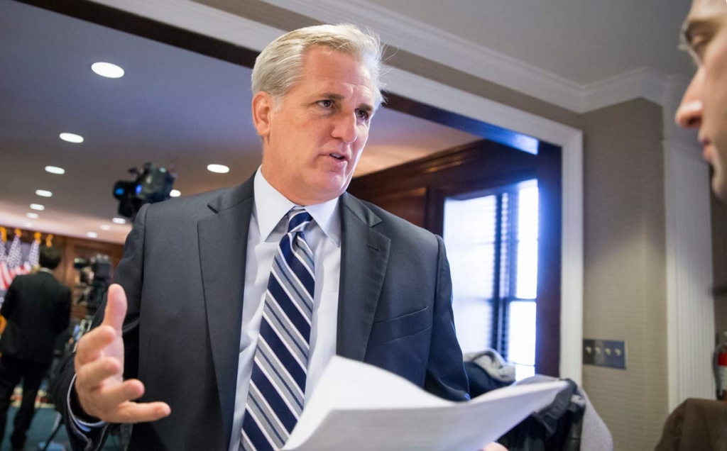 Majority Leader Kevin McCarthy R-Calif. speaks with a reporter following a closed-door GOP caucus meeting at the Republican National Headquarters on Capitol Hill in Washington Tuesday Dec. 8 2015