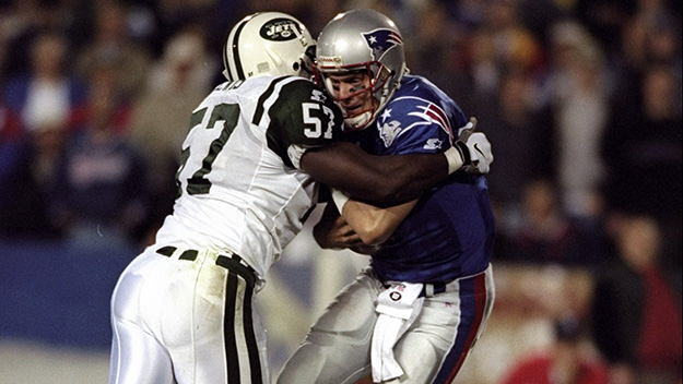 Linebacker Mo Lewis of the New York Jets hits quarterback Drew Bledsoe of the New England Patriots during a game at Foxboro Stadium in 1998. Mandatory Credit Ezra O. Shaw /Allsport