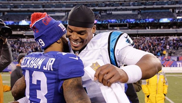 Carolina quarterback Cam Newton right hugs New York Giants receiver Odell Beckham following the Panthers&#39 victory on Sunday in East Rutherford N.J