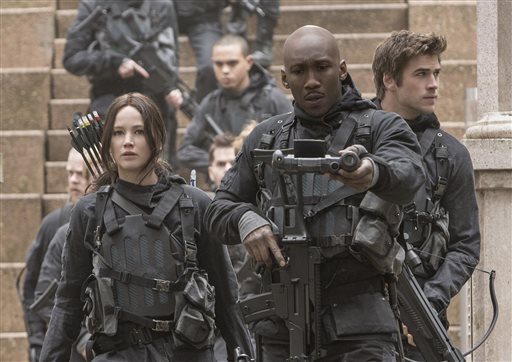 This image released by Lionsgate shows Jennifer Lawrence as Katniss Everdeen from left Mahershala Ali as Boggs and Liam Hemsworth Gale Hawthorne in a scene from'The Hunger Games Mockingjay Part 2