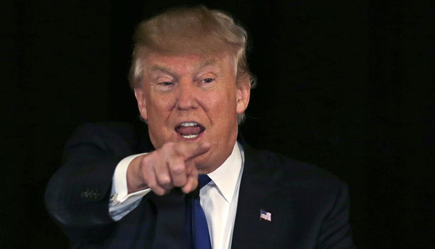 Republican presidential candidate businessman Donald Trump gestures during an address at a regional police union meeting in Po