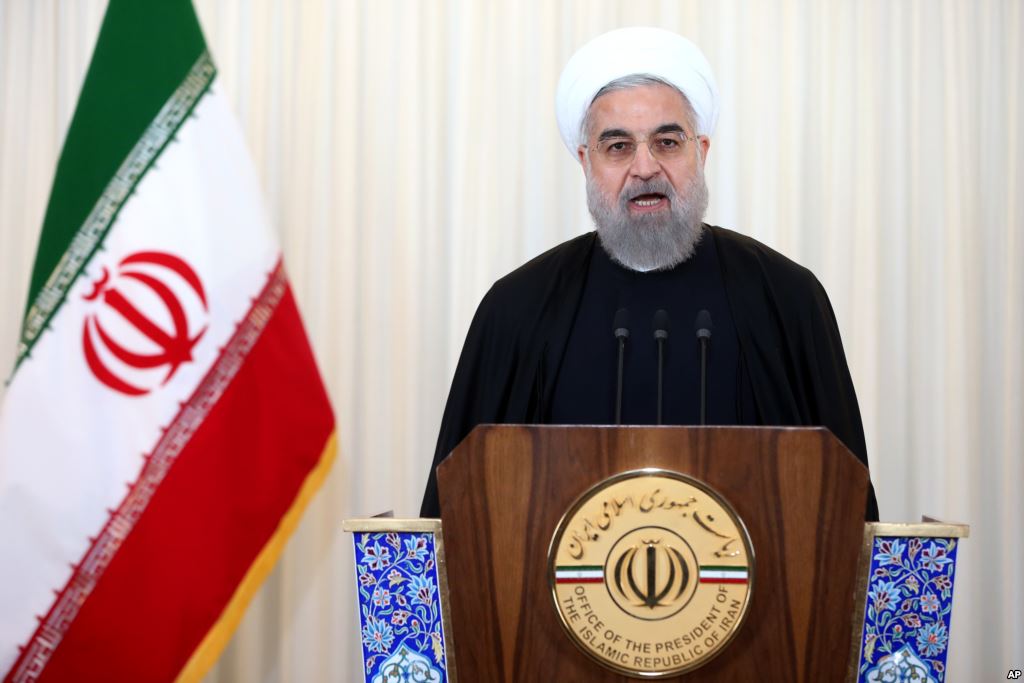 Iran's President Hassan Rouhani addresses the nation in a televised speech after the closure of Iran's nuclear probe at the IAEA meeting at his office in Tehran Iran Dec. 16 2015