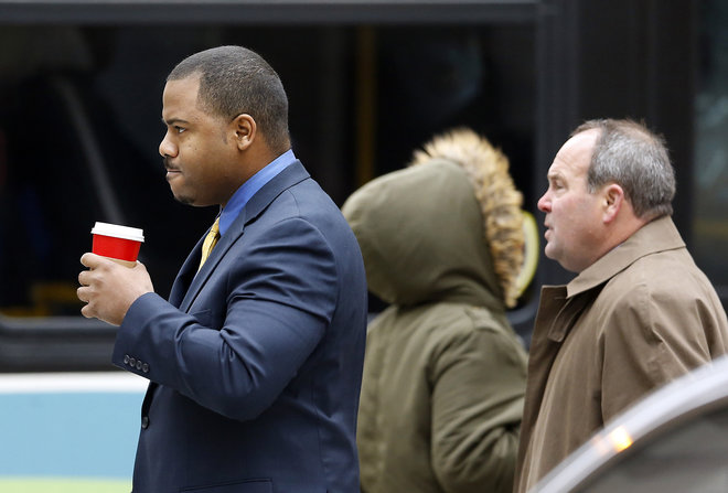 William Porter left one of six Baltimore city police officers charged in connection to the death of Freddie Gray walks to a courthouse with his attorney Joseph Murtha for jury selection in his trial Monday Nov. 30 2015 in Baltimore. Porter faces