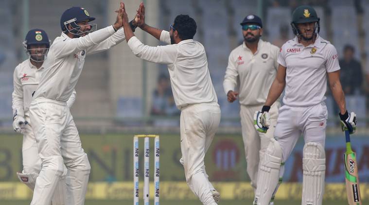 Indian team members celebrate the wicket of South Africa's Faf du Plessis on the last day of their fourth and final test cricket match in New Delhi India Monday Dec. 7 2015