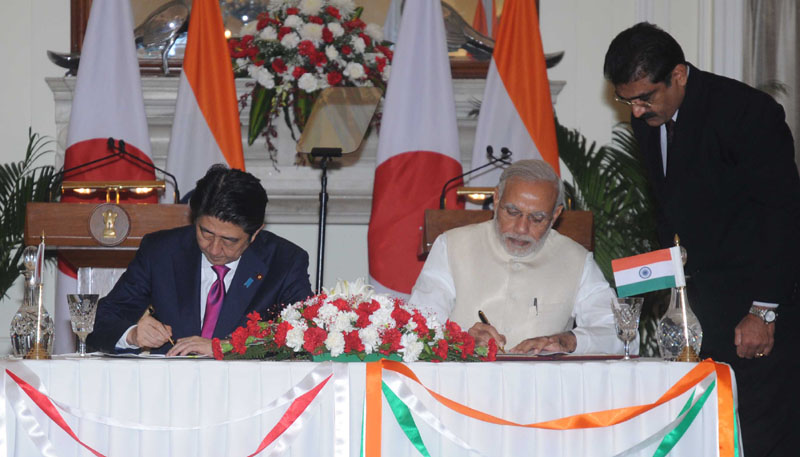 Indian Prime Minister Narendra Modi, and his Japanese counterpart Shinzo Abe are about to shake hands before their meeting in New Delhi India Saturday. Modi hopes the visit of Abe will be a major step in transforming India into an economic powe