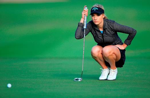 Paige Spiranac of United States lines up a par putt at the par 5 10th hole during the first round of the 2015 Omega Dubai Ladies Masters on the Majlis Course at The Emirates Golf Club