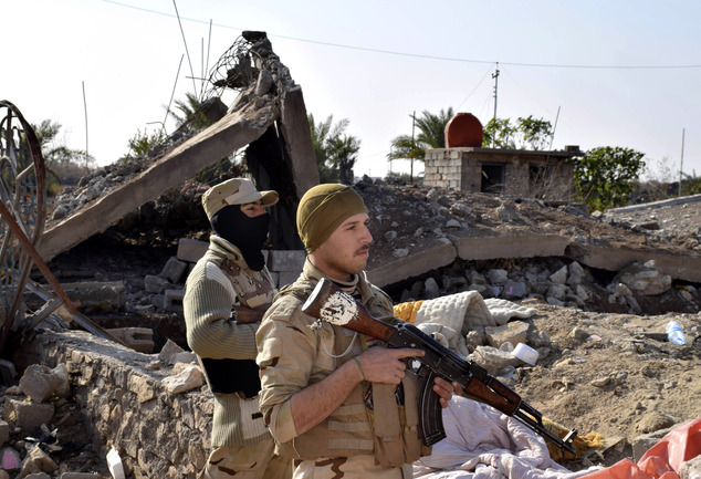 Iraqi soldiers advance their position in northern Ramadi 70 miles west of Baghdad Iraq Monday Dec. 21 2015