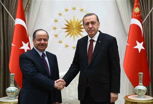 'Act of solidarity: Turkish President Recep Tayyip Erdogan right and President of Iraq'a northern Kurdish region Massoud Barzani shake hands before a meeting in Ankara Turkey Wednesday Dec. 9 2015. Turkish Prime Minister Ahmet Davutoglu on Wednes