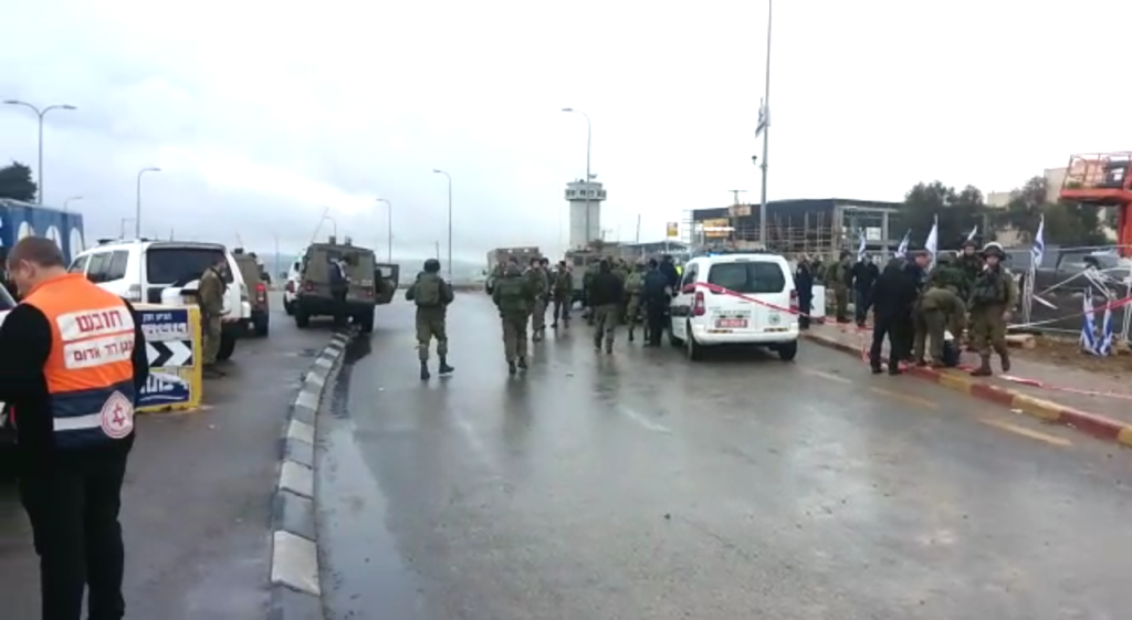 IDF troops police and paramedics at the scene of an attempted stabbing at the Gush Etzion Junction