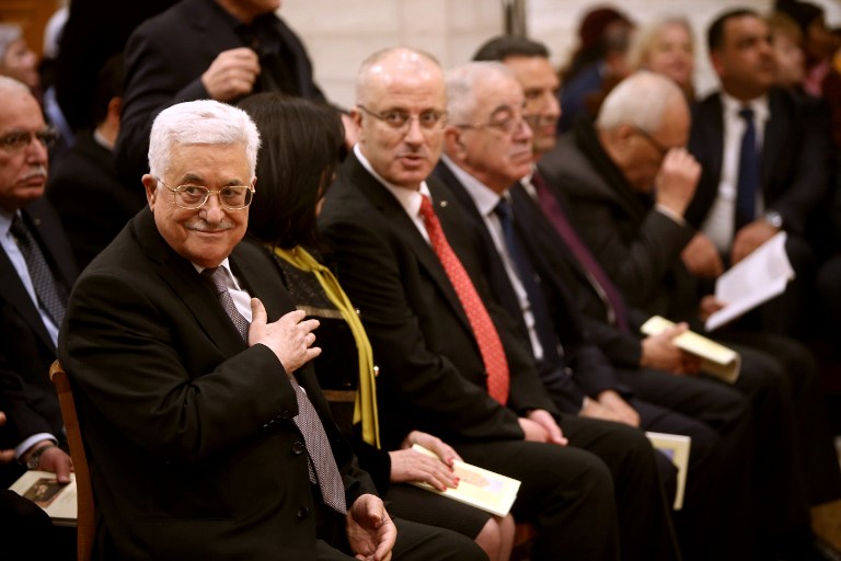 Palestinian Authority President Mahmoud Abbas attends a Christmas Midnight Mass at the Church of the Nativity in the West Bank town of Bethlehem