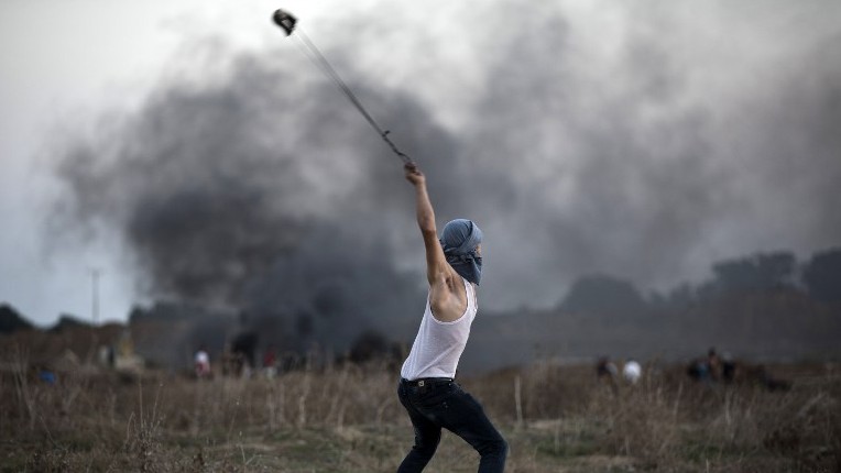 Palestinians gather for funeral of shot woman as violence continues