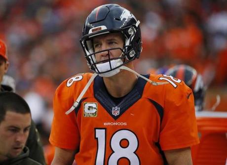 A dejected Denver Broncos quarterback Peyton Manning looks on from the sidelines during an NFL football game between the Denver Broncos and the Kansas City Chiefs Sunday Nov. 15 2015 in Denver