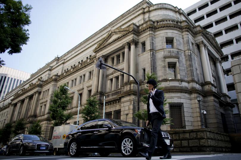 Japan central bank expands asset purchases to spur more corporate investment hiring