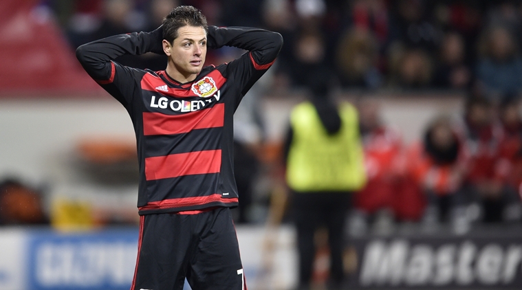 Leverkusen's Javier Hernandez looks on after his team was eliminated from the Champions League at the end of the Champions League Group E soccer match between Bayer Leverkusen and FC Barcelona in Leverkusen western Germany Wednesday Dec. 9 2015. (AP P