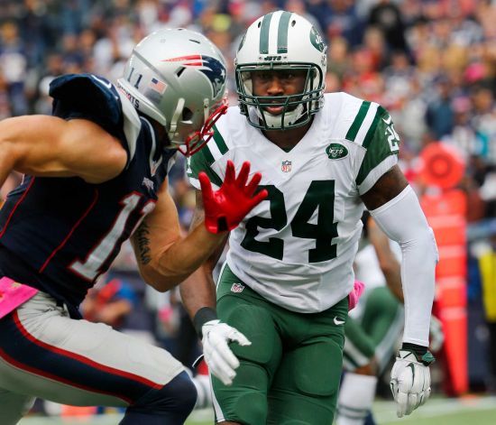 New York Jets cornerback Darrelle Revis covers New England Patriots wide receiver Julian Edelman during an NFL football game in Foxborough Mass. The Jets are expected to get a better idea of cornerback Darre