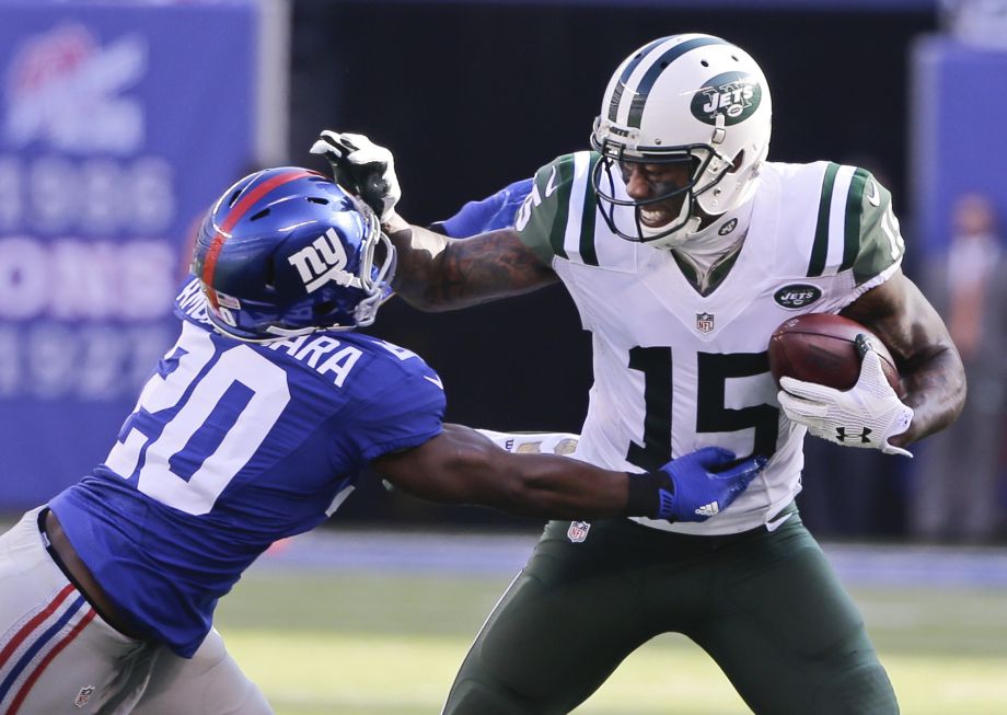 New York Jets wide receiver Brandon Marshall stiff-arms New York Giants Prince Amukamara during the first half of an NFL football game Sunday Dec. 6 2015 in East Rutherford N.J