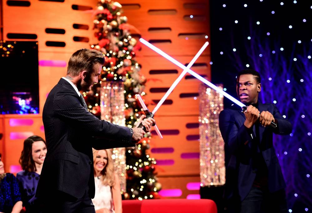 David Beckham foolishly challenges John Boyega to lightsaber duel