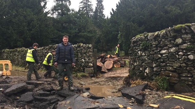 Jon Holdsworth of Patterdale Hall Estate inspects flood damage outside the estate near the village of Glenridding in Cumbria