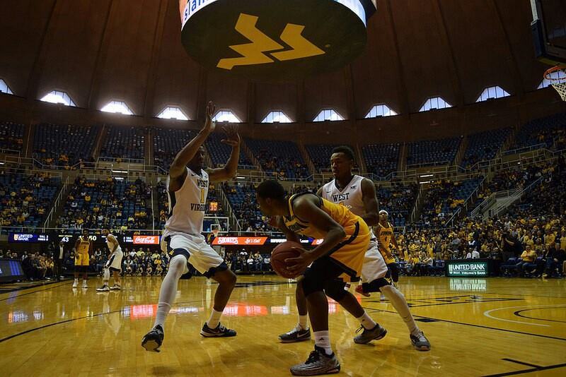 Jonathan Holton and Daxter Miles Jr defending a Kennesaw State player