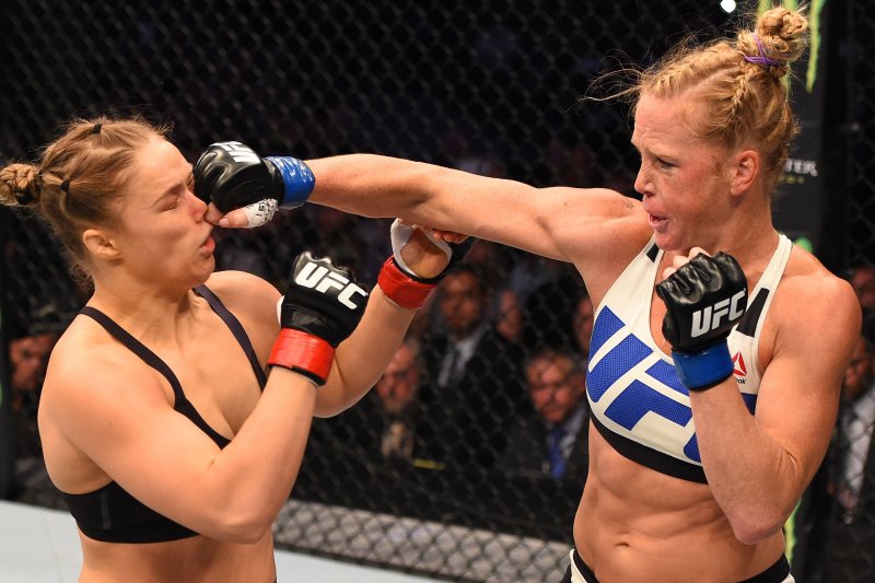 Holly Holm of the United States punches Ronda Rousey of the United States in their UFC women's bantamweight championship bout during the UFC 193 event at Etihad Stadium