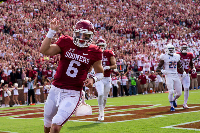 Junior quarterback Baker Mayfield celebrates after scoring a touchdown at Gaylord Memorial Stadium Saturday Sep. 19 2015