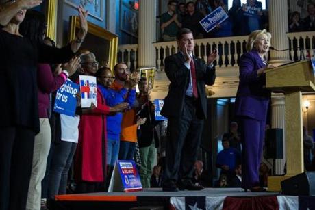 Boston MA- 11/29/2015- Boston Mayor Marty Walsh claps as U.S. Presidential candidate Hillary Clinton speaks during a campaign rally at Faneuil Hall in Boston MA