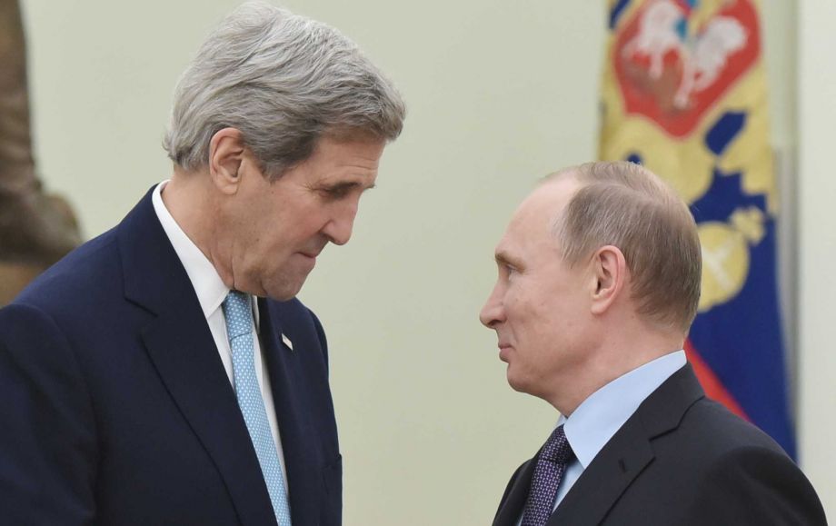 US Secretary of State John Kerry left speaks with Russia's President Vladimir Putin during a meeting at the Kremlin in Moscow Tuesday Dec. 15 2015. The United States and Russia need to find'common ground to end Syria's civil war and restore stabilit