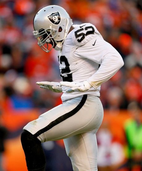 Oakland Raiders defensive end Khalil Mack celebrates after one of his five sacks on the day against the Denver Broncos during the second half of an NFL football game Sunday Dec. 13 2015 in Denver