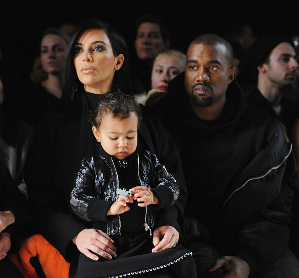 NEW YORK NY- FEBRUARY 14  Kim Kardashian North West and Kanye West attend the Alexander Wang Fashion Show during Mercedes Benz Fashion Week Fall 2015 at Pier 94