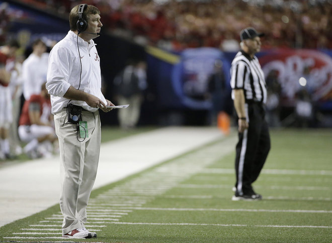 Alabama defensive coach Kirby Smart watches play against Florida during the first half of the Southeastern Conference championship NCAA college football game in Atlanta. Georgia hired Smart as its new head coach on S