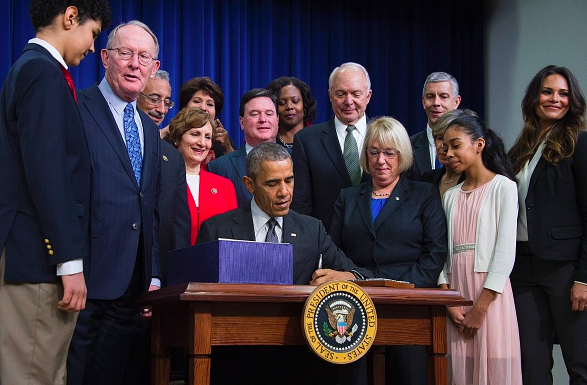 President Barack Obama signs S.1177 the'Every Student Succeeds Act, a bipartisan rewrite of No Child Left Behind at the Eisenhower Executive Office Building in Washington DC