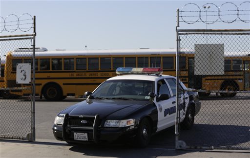 A police officer put up yellow tape to close the school outside of Edward Roybal High School in Los Angeles this morning. All schools in the vast Los Angeles Unified School District the nation’s second largest have been ordered closed due to an elect