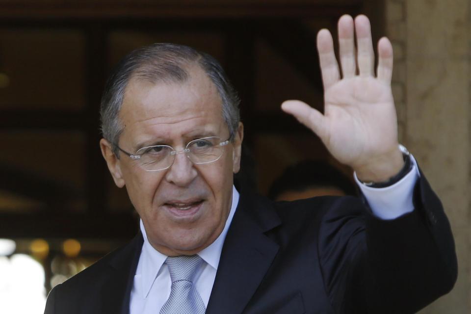 Russian Foreign Minister Sergey Lavrov as he waves to the media after he arrives at the presidential palace for talks with Cyprus&#039 President Nicos Anastasiades in Nicosia Wednesday Dec. 2 2015