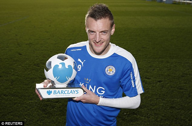 Leicester forward Vardy looks delighted as he poses with the November Player of the Month award